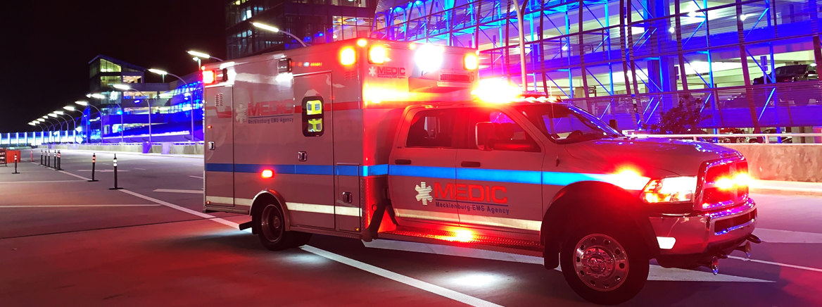 Photo of a MEDIC ambulance at night.