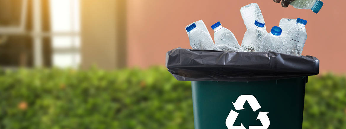 Recycling bins filled with empty water bottles.