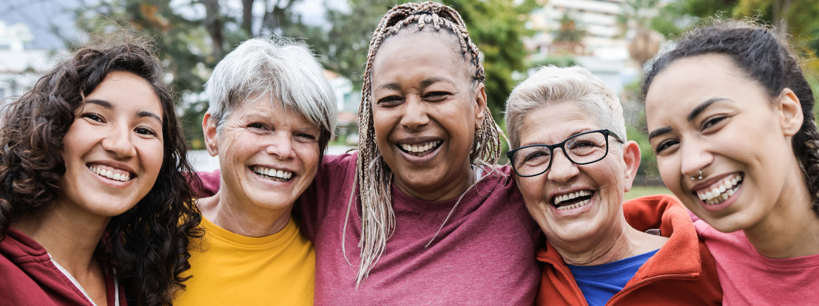 Happy multi generational women having fun together - Multiracial friends smiling on camera after sport workout outdoor - Main focus on african female face